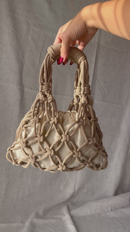 holding the sian bag macrame bag