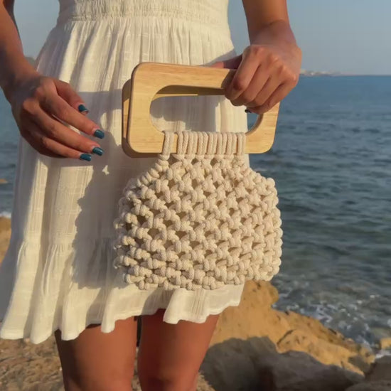 Koma bag in Natural, video showing the functionality of the bag, styled in a white mini sundress.