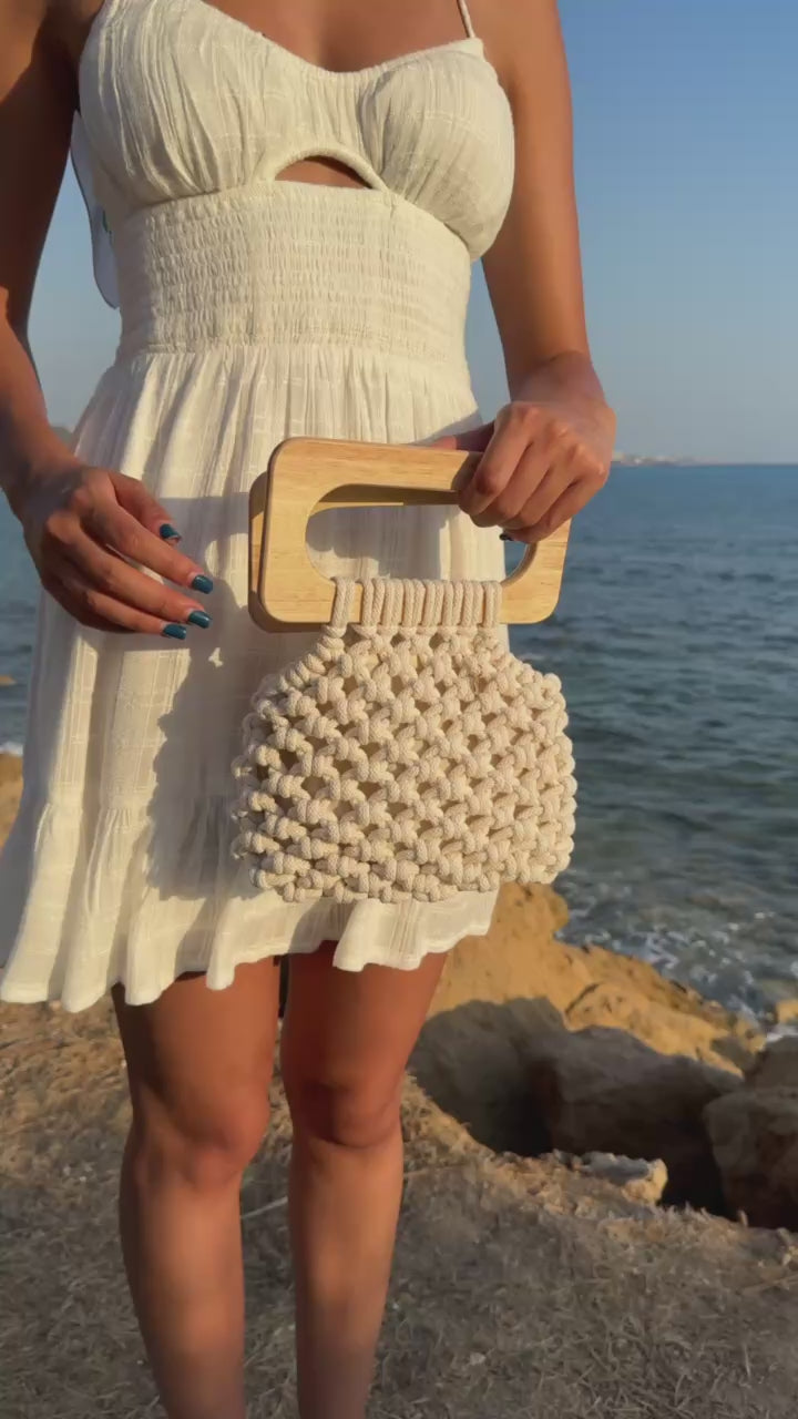 Koma bag in Natural, video showing the functionality of the bag, styled in a white mini sundress.
