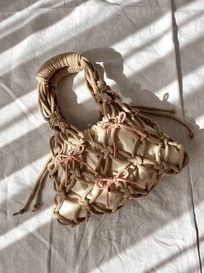 sian bag laid down with bows